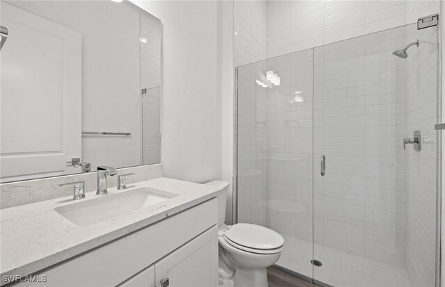 18372 Ridgeline Dr, Estero, FL 33928 - bathroom with a stall shower, vanity, and toilet