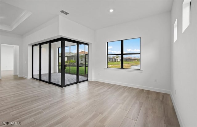 18372 Ridgeline Dr, Estero, FL 33928 - spare room featuring light wood-type flooring, baseboards, visible vents, and recessed lighting