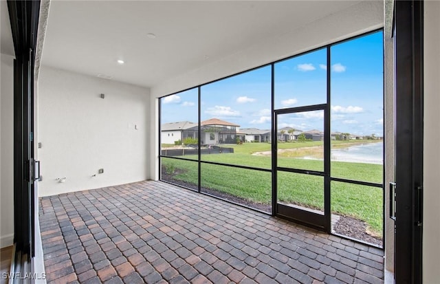 18372 Ridgeline Dr, Estero, FL 33928 - unfurnished sunroom featuring a residential view