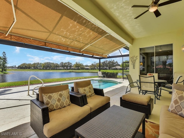 view of patio / terrace with a water view, ceiling fan, a lanai, an outdoor pool, and an outdoor living space