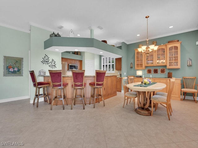 dining space featuring light tile patterned floors, recessed lighting, baseboards, ornamental molding, and an inviting chandelier