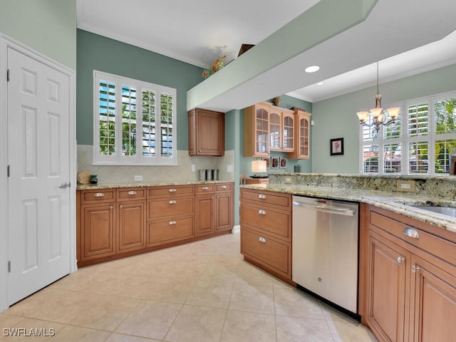 kitchen with ornamental molding, brown cabinetry, and dishwasher