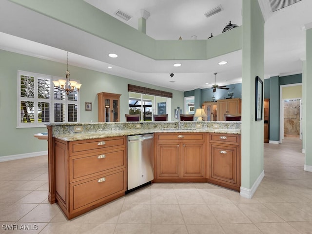 kitchen with brown cabinetry, dishwasher, a sink, and light stone countertops