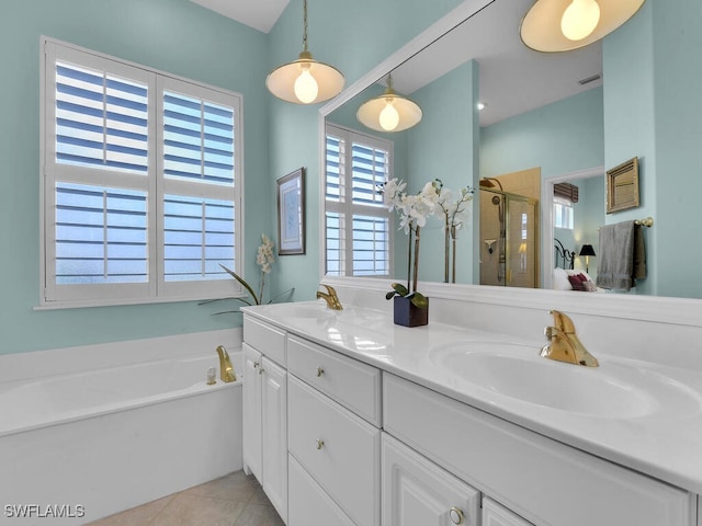 full bathroom with double vanity, a sink, tile patterned flooring, a shower stall, and a bath