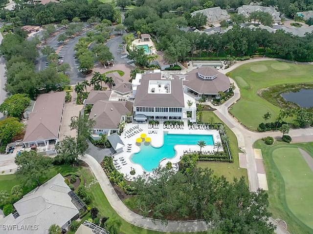 birds eye view of property with view of golf course and a residential view