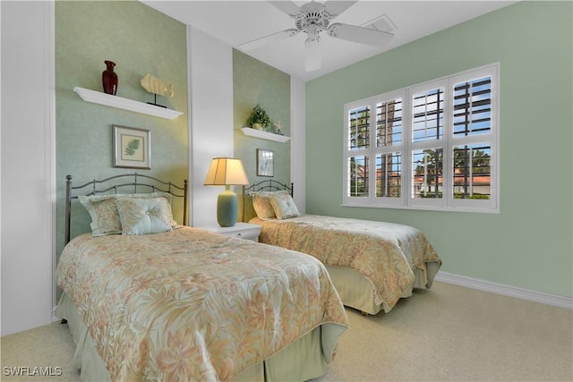 bedroom featuring carpet floors, a ceiling fan, visible vents, and baseboards