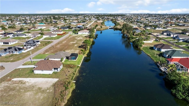 bird's eye view with a residential view and a water view