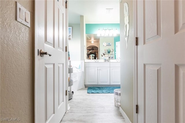 hallway featuring light wood-type flooring