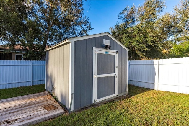 view of shed with a fenced backyard