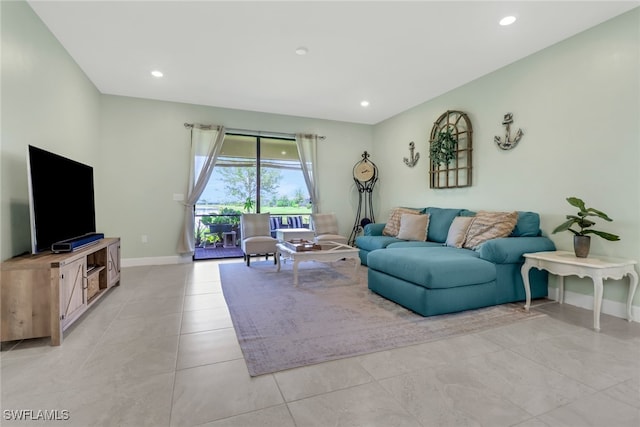 living room with baseboards, light tile patterned floors, and recessed lighting