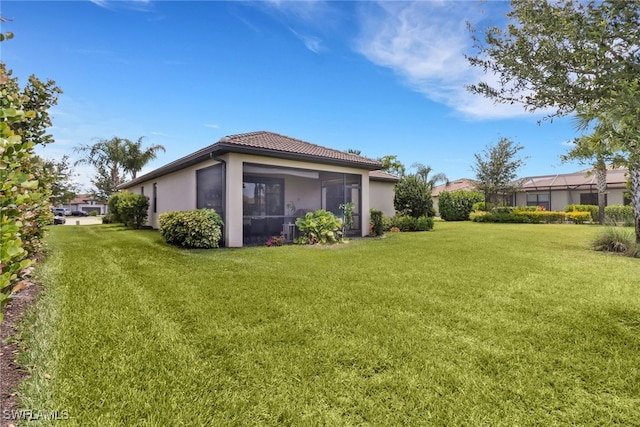 view of yard featuring a sunroom