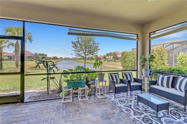 sunroom / solarium with a water view