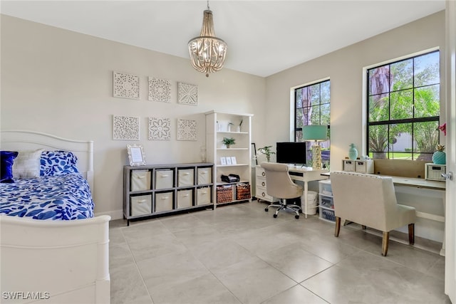 office space with a chandelier, light tile patterned flooring, and baseboards