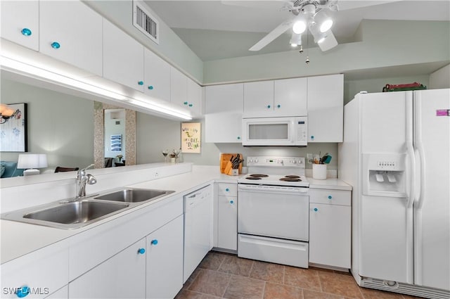 kitchen featuring visible vents, light countertops, white cabinets, white appliances, and a sink