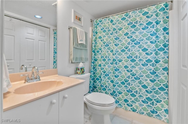 full bathroom with vanity, tile patterned floors, toilet, and a shower with curtain