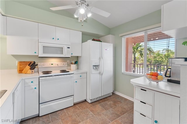 kitchen with white appliances, a ceiling fan, baseboards, light countertops, and white cabinetry