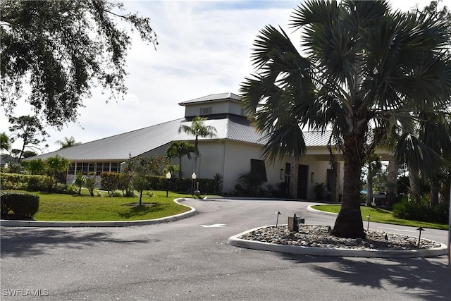 exterior space featuring curved driveway