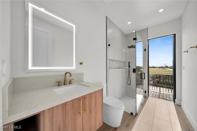 full bath with recessed lighting, vanity, toilet, and a shower stall