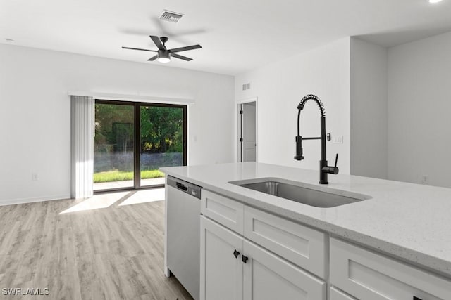 325/327 Harold Ave S, Lehigh Acres, FL 33973 - kitchen featuring a sink, visible vents, white cabinetry, stainless steel dishwasher, and light wood-type flooring