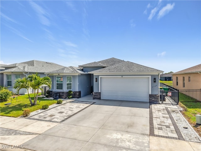 view of front facade featuring a garage, a front lawn, fence, and stucco siding