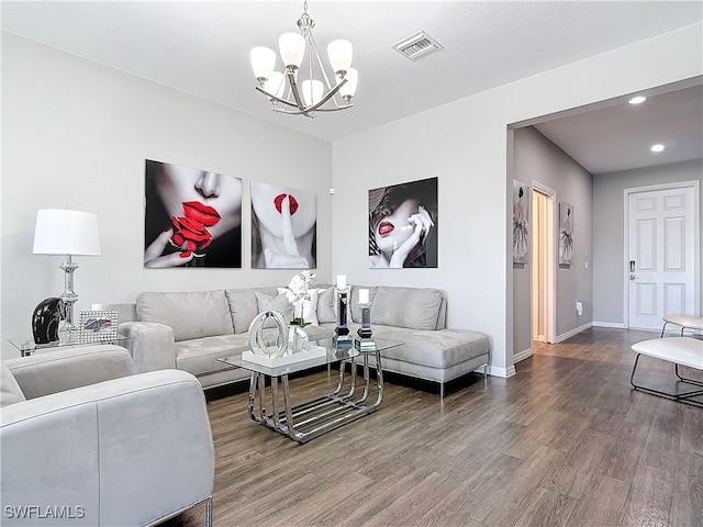 living area with a chandelier, recessed lighting, wood finished floors, visible vents, and baseboards