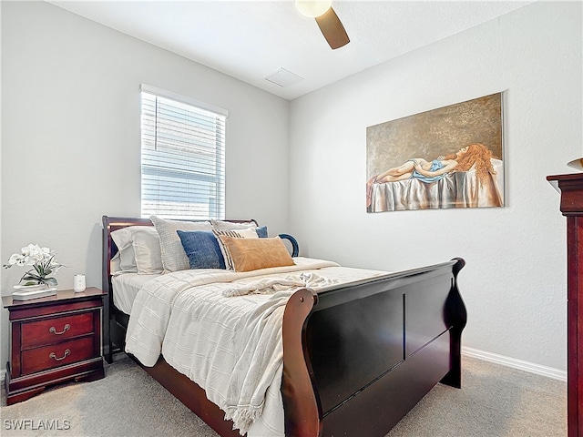 carpeted bedroom with ceiling fan, visible vents, and baseboards