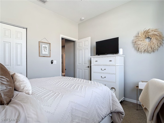 bedroom featuring carpet floors, a closet, and baseboards