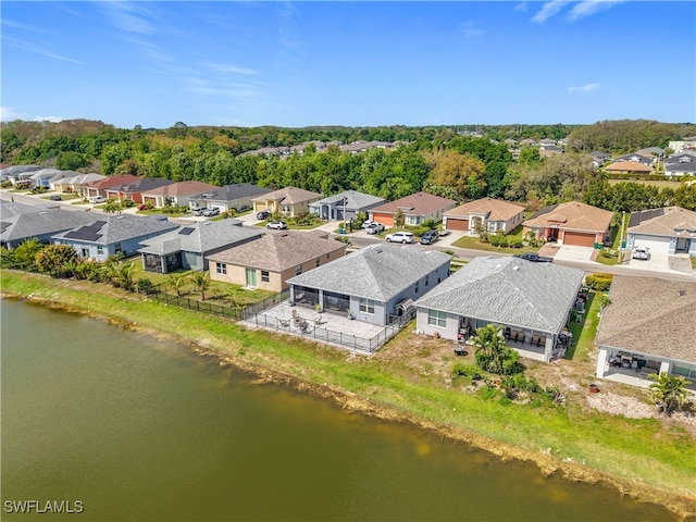 bird's eye view featuring a water view and a residential view