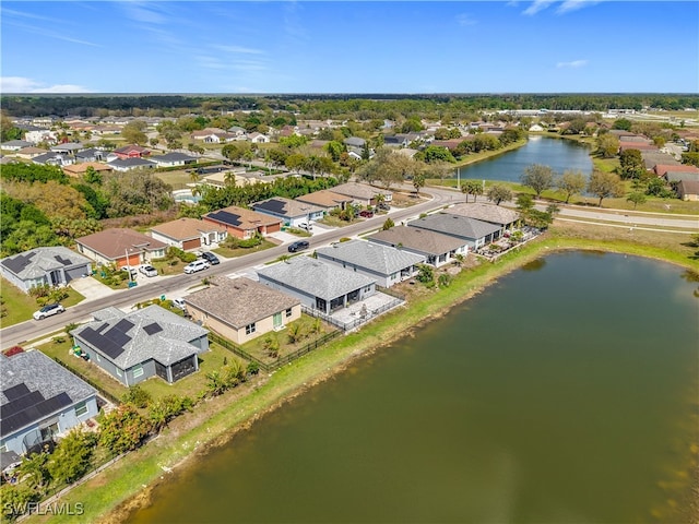 birds eye view of property with a residential view and a water view