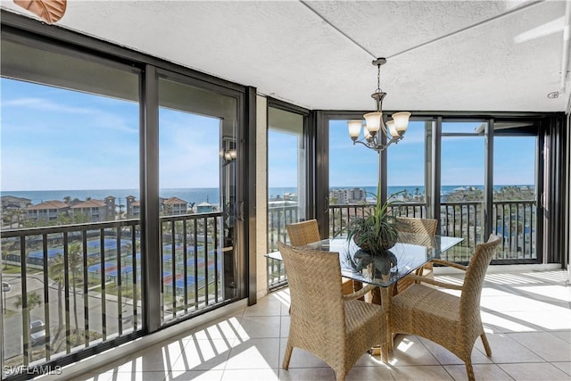 sunroom with a notable chandelier