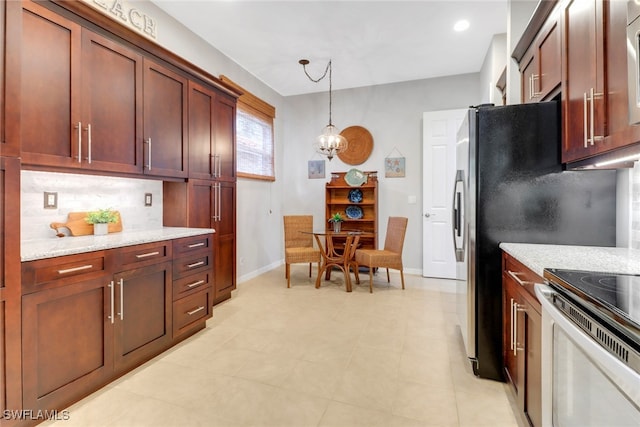 kitchen featuring light stone counters, decorative light fixtures, stainless steel electric stove, decorative backsplash, and an inviting chandelier