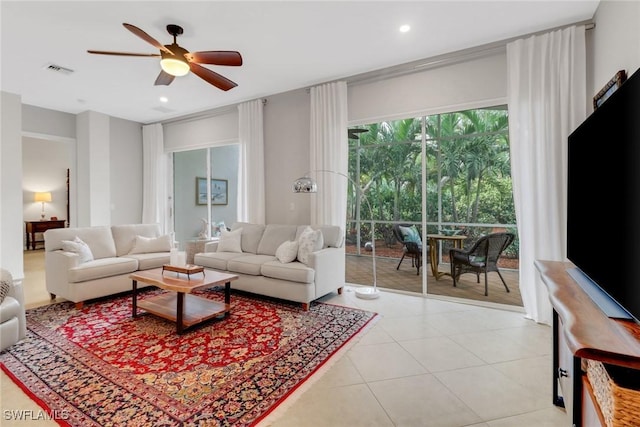 living area with recessed lighting, visible vents, ceiling fan, and light tile patterned floors