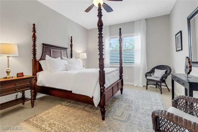 bedroom featuring baseboards, a ceiling fan, and light colored carpet