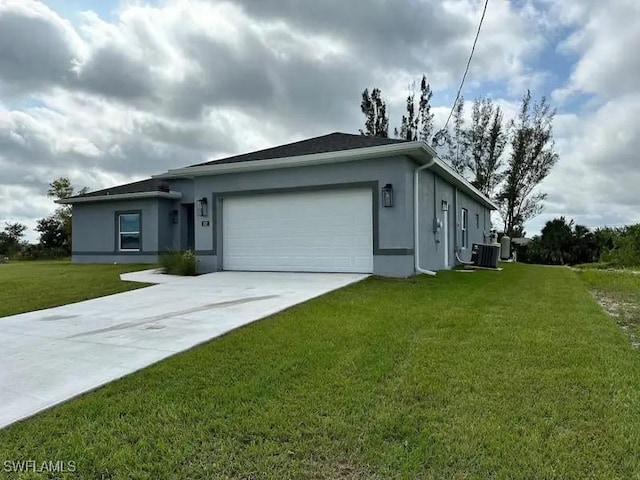 ranch-style house with stucco siding, central AC unit, a front yard, a garage, and driveway