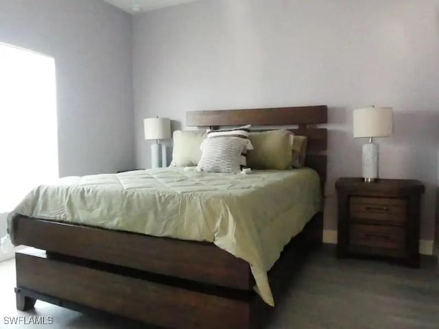 bedroom featuring wood finished floors