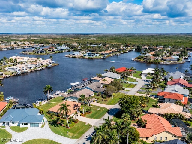 birds eye view of property featuring a residential view and a water view