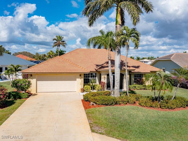 view of front facade featuring a garage, concrete driveway, a tiled roof, a front lawn, and stucco siding