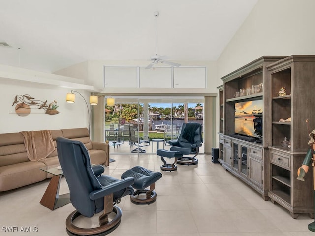 living room featuring ceiling fan, visible vents, and high vaulted ceiling