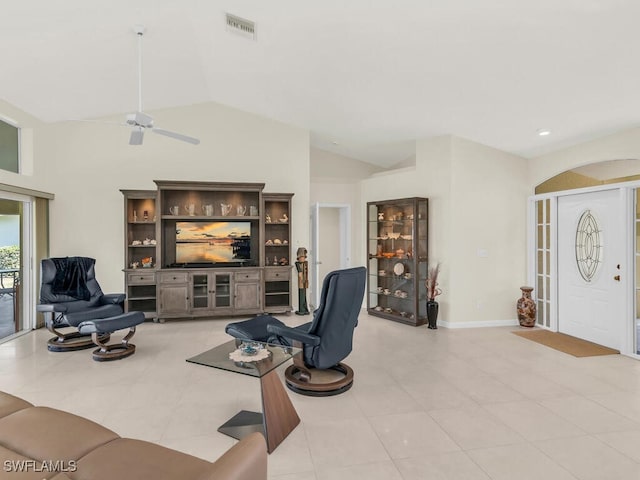 living area with lofted ceiling, ceiling fan, visible vents, and baseboards