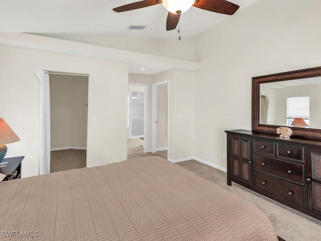 bedroom with lofted ceiling, light colored carpet, visible vents, ceiling fan, and baseboards