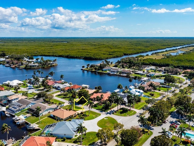 drone / aerial view featuring a water view and a residential view