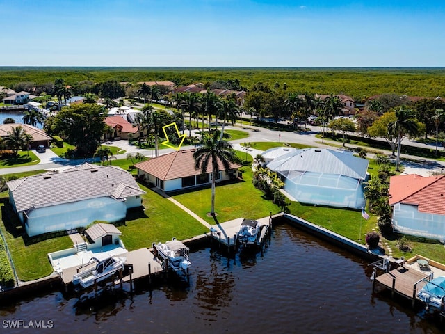 birds eye view of property with a residential view and a water view