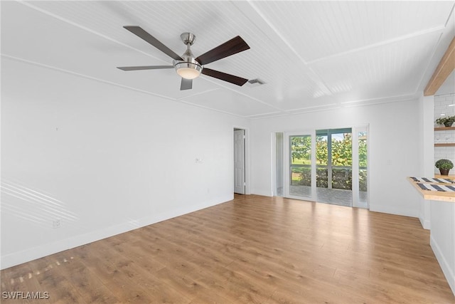 unfurnished living room with light wood-type flooring, ceiling fan, visible vents, and baseboards