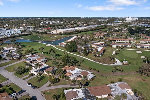 aerial view featuring a residential view, a water view, and golf course view