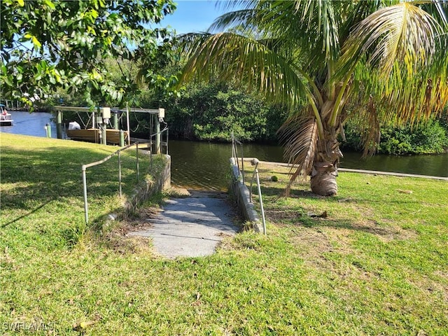 27253 Rio Vista Cir, Bonita Springs, FL 34135 - view of yard featuring a boat dock and a water view