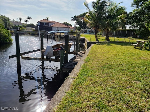 27253 Rio Vista Cir, Bonita Springs, FL 34135 - view of dock with a lawn, a water view, and boat lift