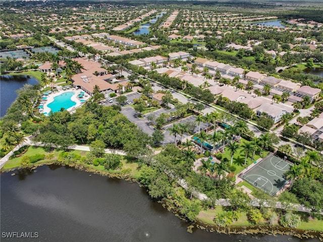 drone / aerial view featuring a water view and a residential view