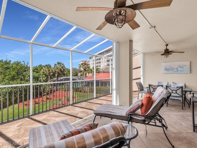 view of patio / terrace featuring a lanai and ceiling fan