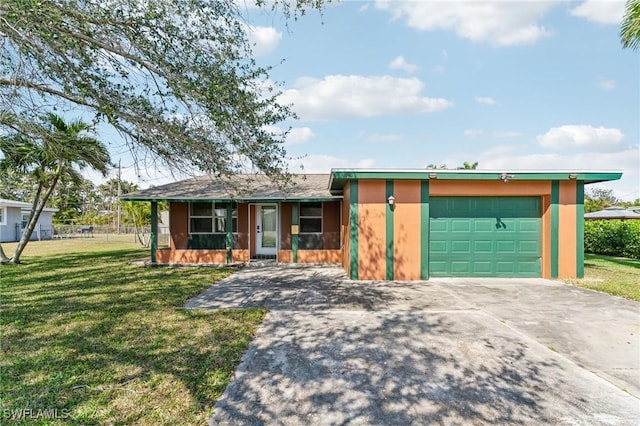 view of front facade featuring driveway, a front lawn, and an attached garage