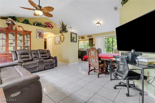 living room with arched walkways, light tile patterned floors, lofted ceiling, visible vents, and ceiling fan